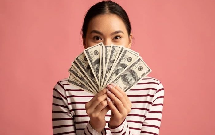 Photo of a woman with money